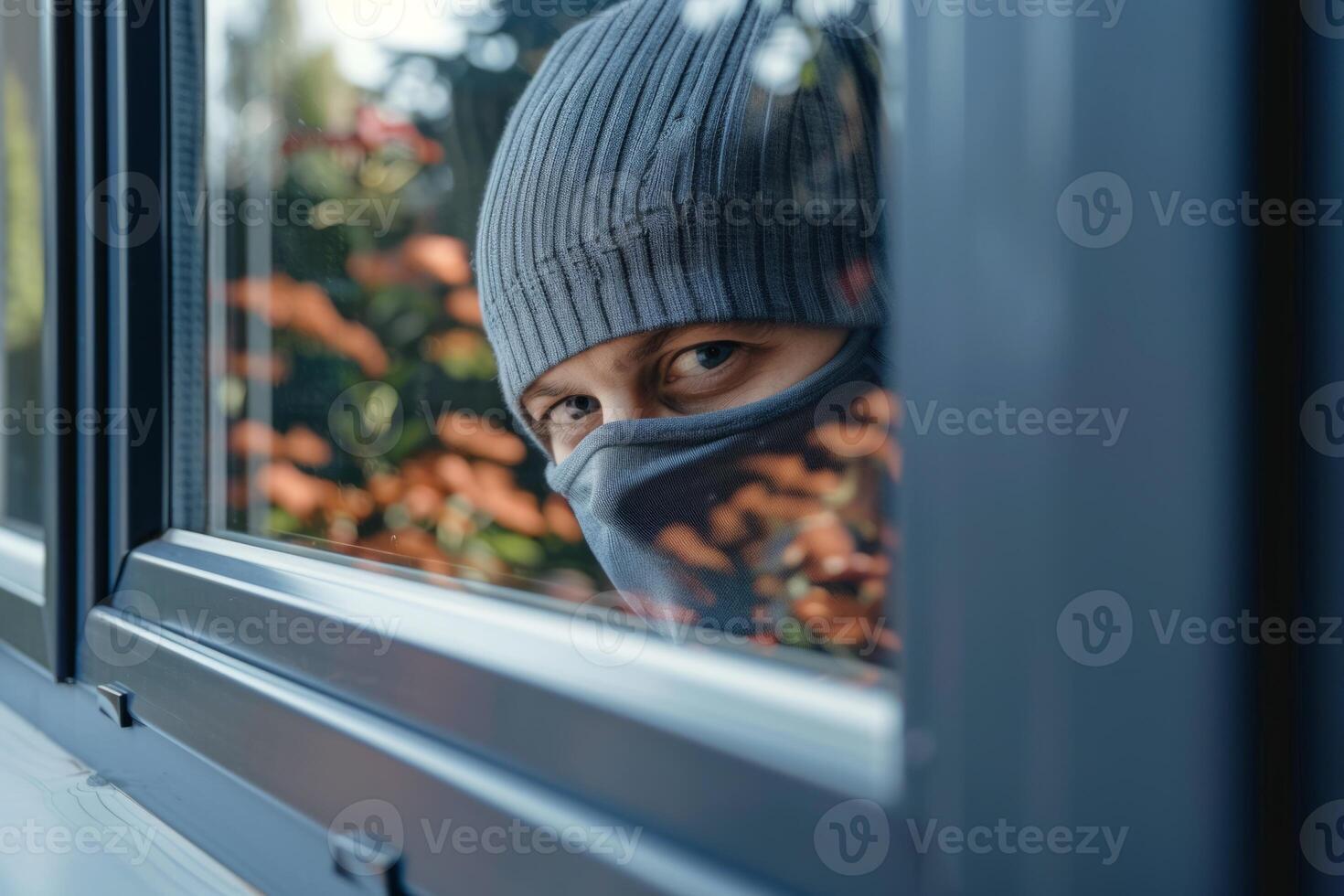 Burglar thief robbing house criminal activity robbery burglary mask crime scene stealing mugger security risk cctv camera catch illegal activity dangerous evil violence gun balaclava photo