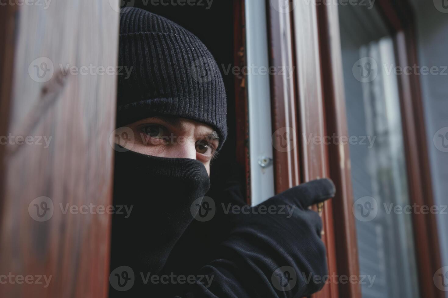 Burglar thief robbing house criminal activity robbery burglary mask crime scene stealing mugger security risk cctv camera catch illegal activity dangerous evil violence gun balaclava photo