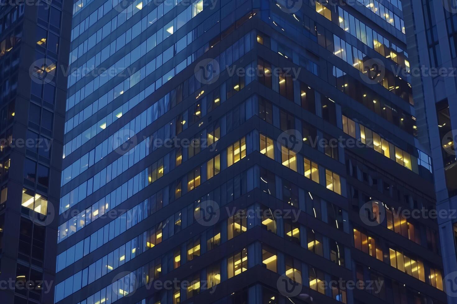 Modern office building windows lit in evening night early morning long working hours exhaustion overtime exterior urban architecture skyscraper lights tower financial sector banking hq photo