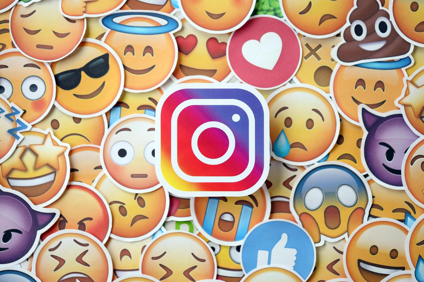 KYIV, UKRAINE - APRIL 20, 2024 Instagram logo and large set of stickers with Emoji yellow faces. Emoji is a pictogram or smiley embedded in text and used in electronic messages photo