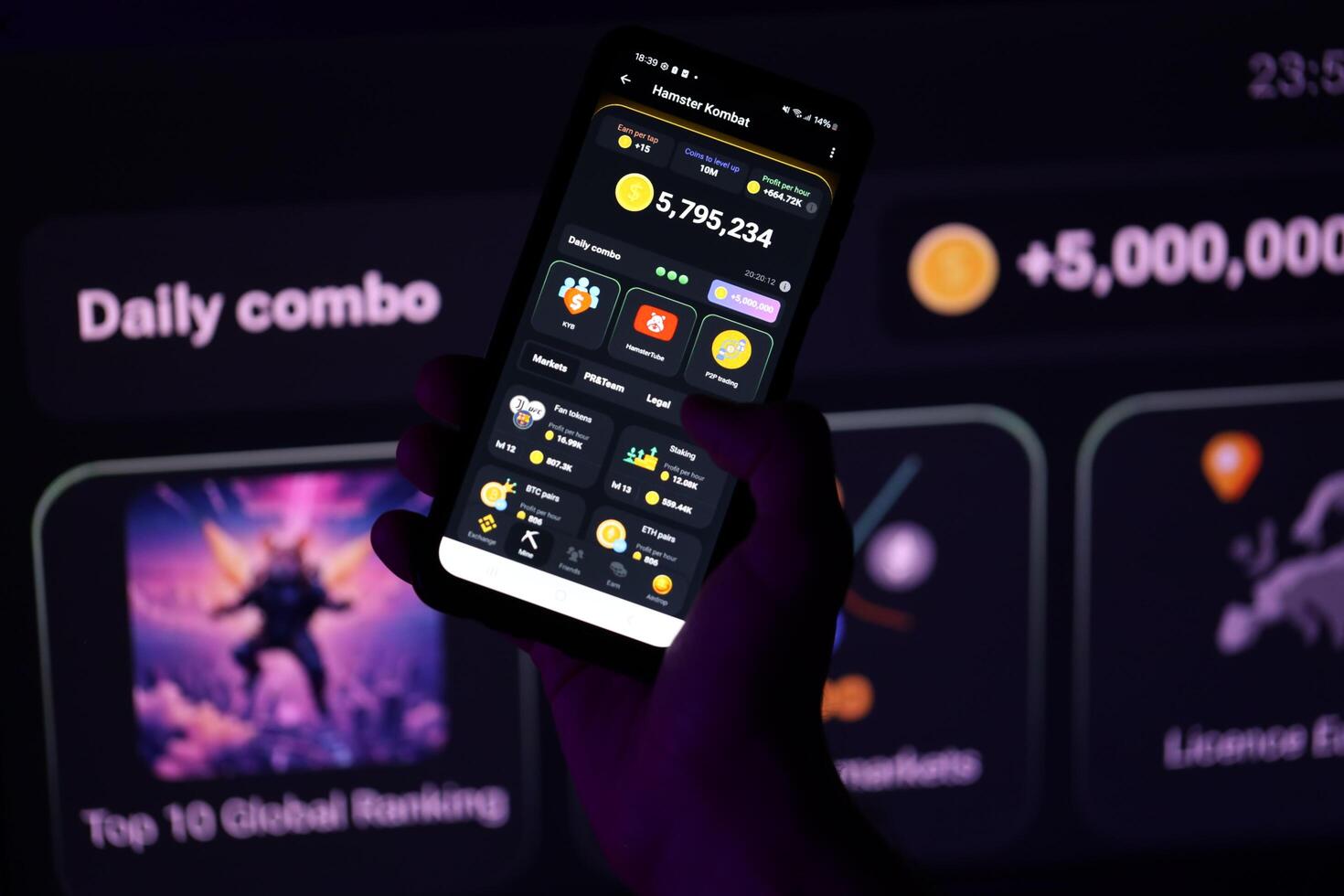 KYIV, UKRAINE - APRIL 20, 2024 Hamster Kombat telegram bot on smartphone screen. Hamster Kombat is a viral Telegram-based crypto game for earn HMSTR tokens by managing virtual crypto exchange photo