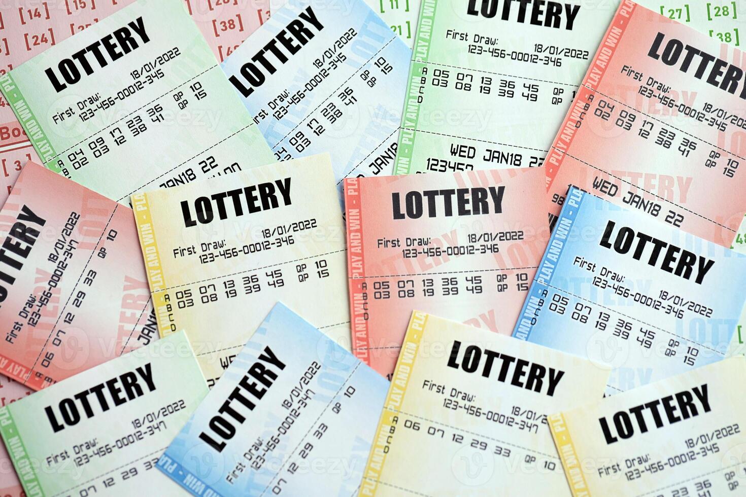 Many lottery tickets on blank bills with numbers for playing lottery photo