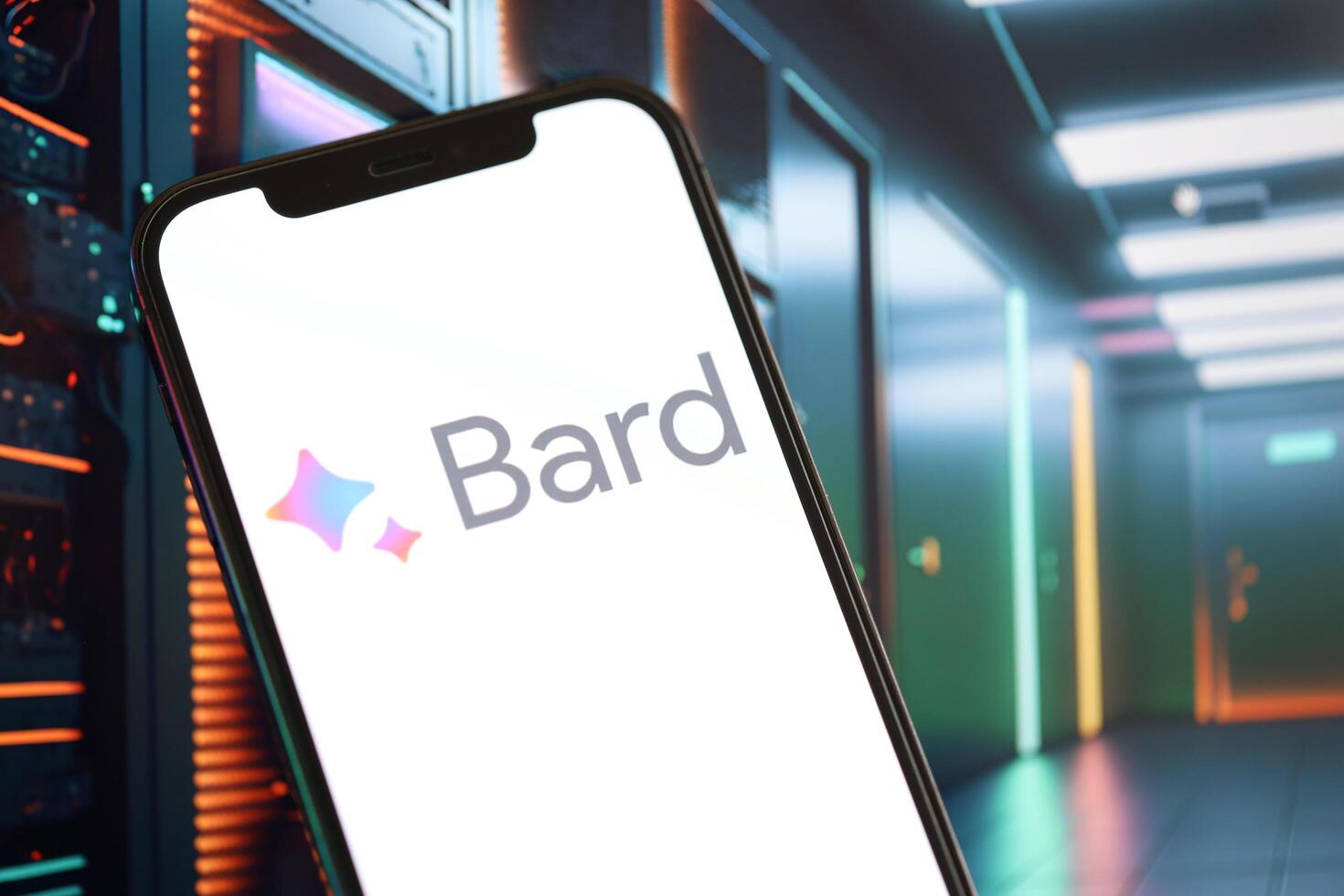KYIV, UKRAINE - MARCH 17, 2024 Google Bard logo on iPhone display screen with background of artificial intelligence futuristic image photo