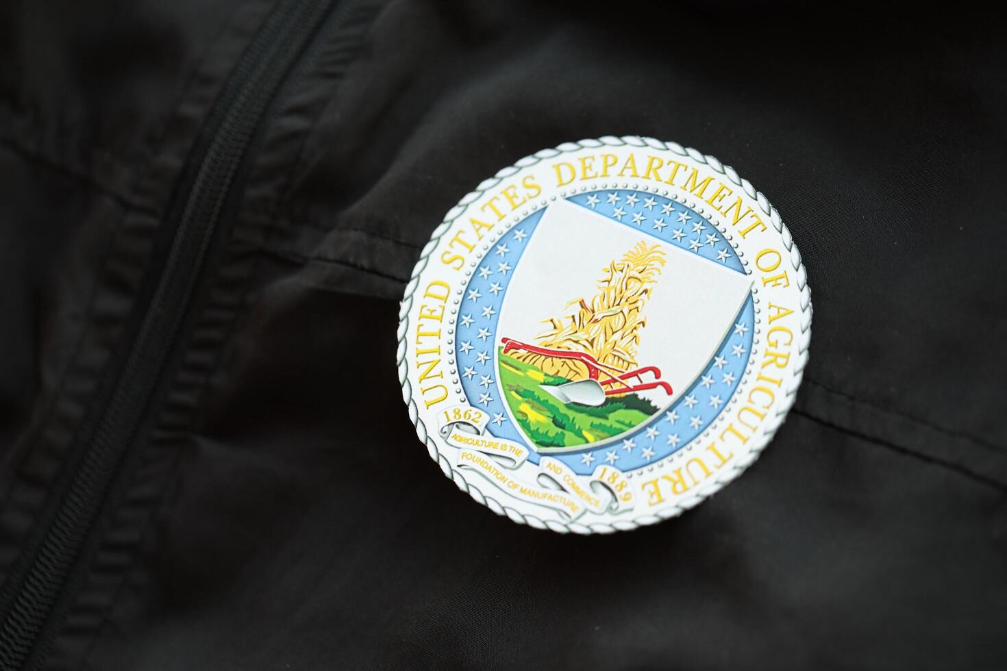 KYIV, UKRAINE - MARCH 9, 2024 US Department of Agriculture seal on black jacket uniform photo