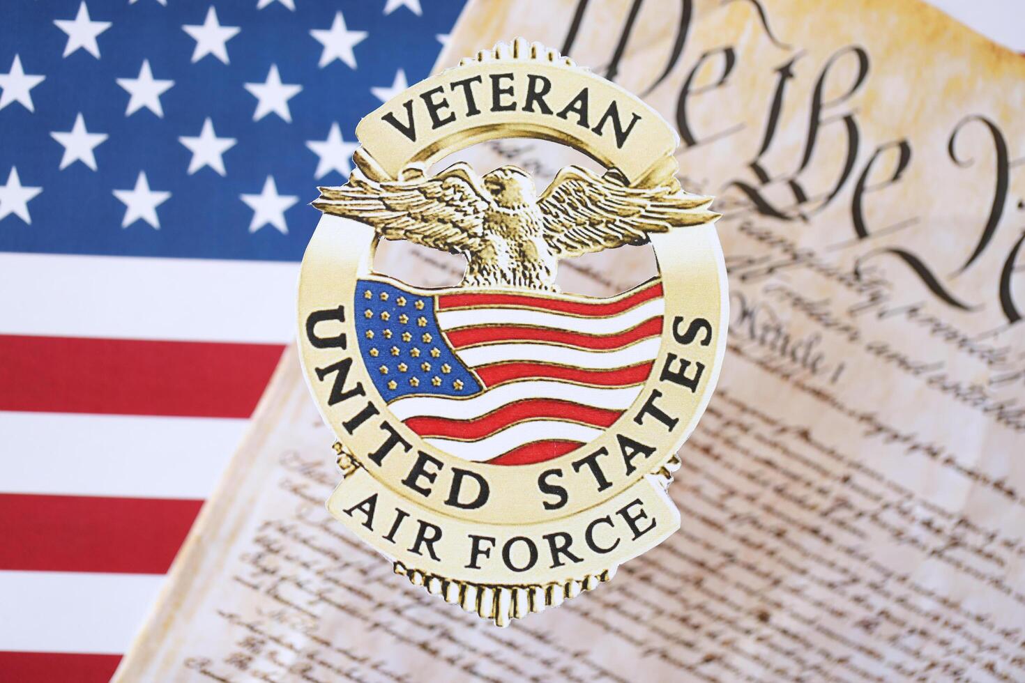KYIV, UKRAINE - MARCH 9, 2024 US Air Force Veteran badge with United States Constitution on flag photo