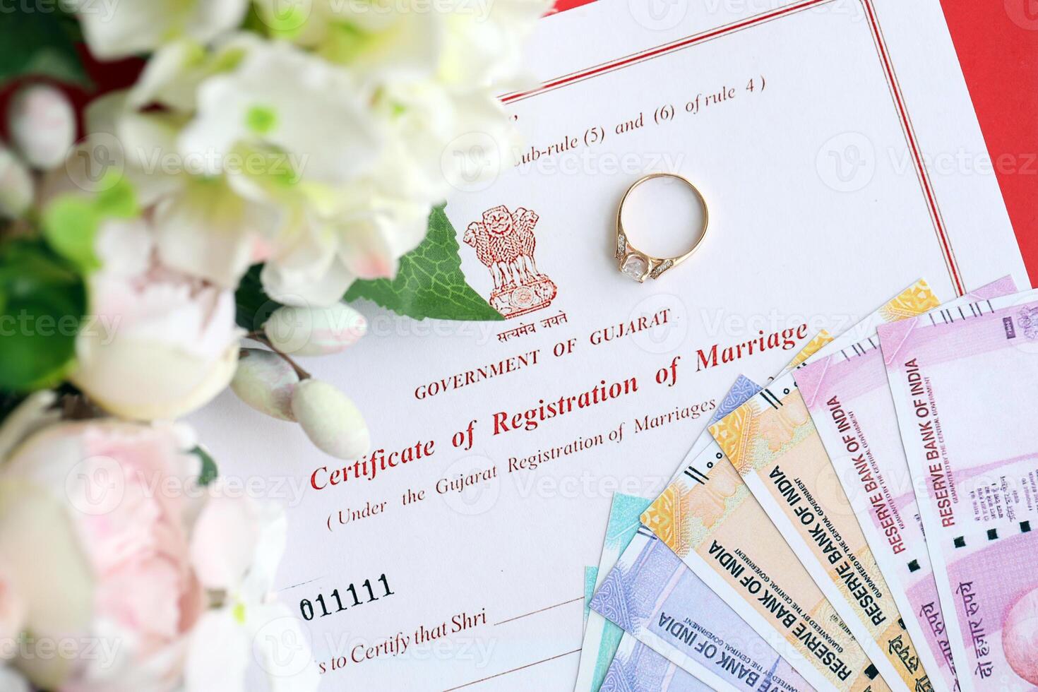 Indian Certificate of registration of marriage blank document and wedding ring with rupiah money photo