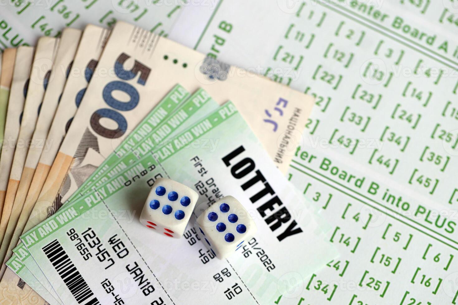 Green lottery tickets and ukrainian money bills on blank with numbers for playing lottery photo