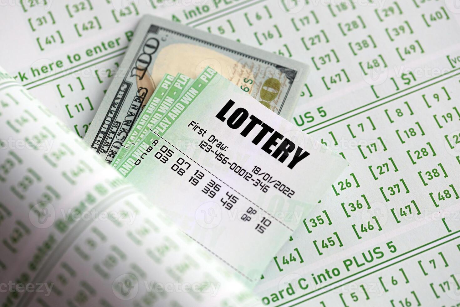 Green lottery tickets and US money bills on blank with numbers for playing lottery photo