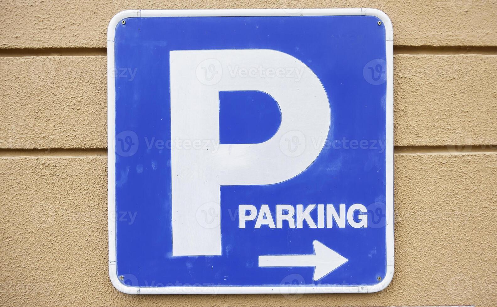 Parking sign on a wall photo