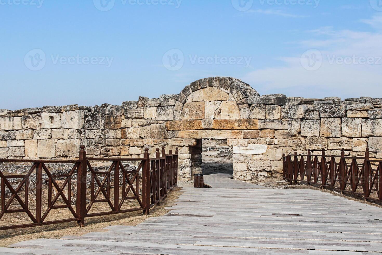 Southern Byzantine Gate at Hierapolis ancient site in Denizli province of Turkey. Built of travertine blocks and reused masonry. Destroyed ancient city in Europe. Popular destination. Pamukkale photo