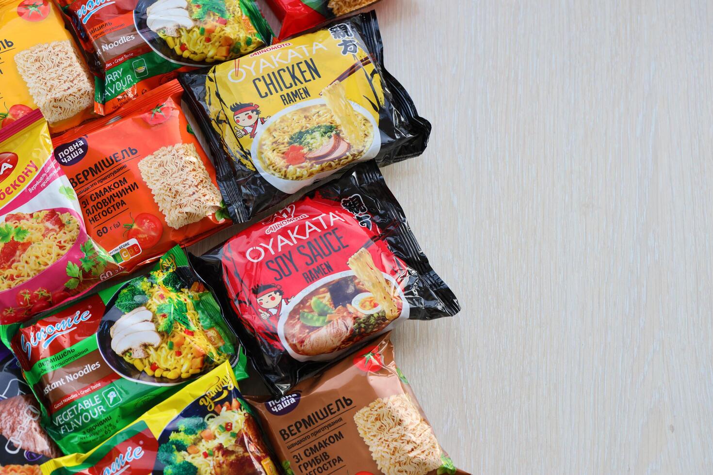 KYIV, UKRAINE - OCTOBER 31, 2023 Many packs of instant noodles for fast cooking by various brands and manufacturers photo