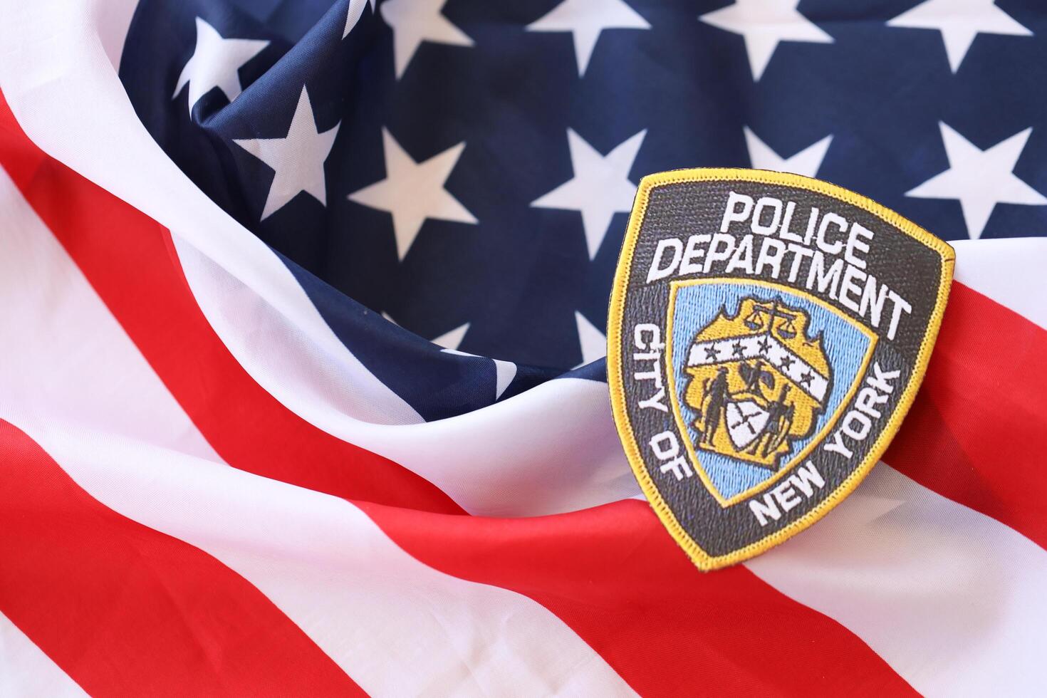 KYIV, UKRAINE - MARCH 9, 2024 US NYPD Police patch on United States of America flag photo