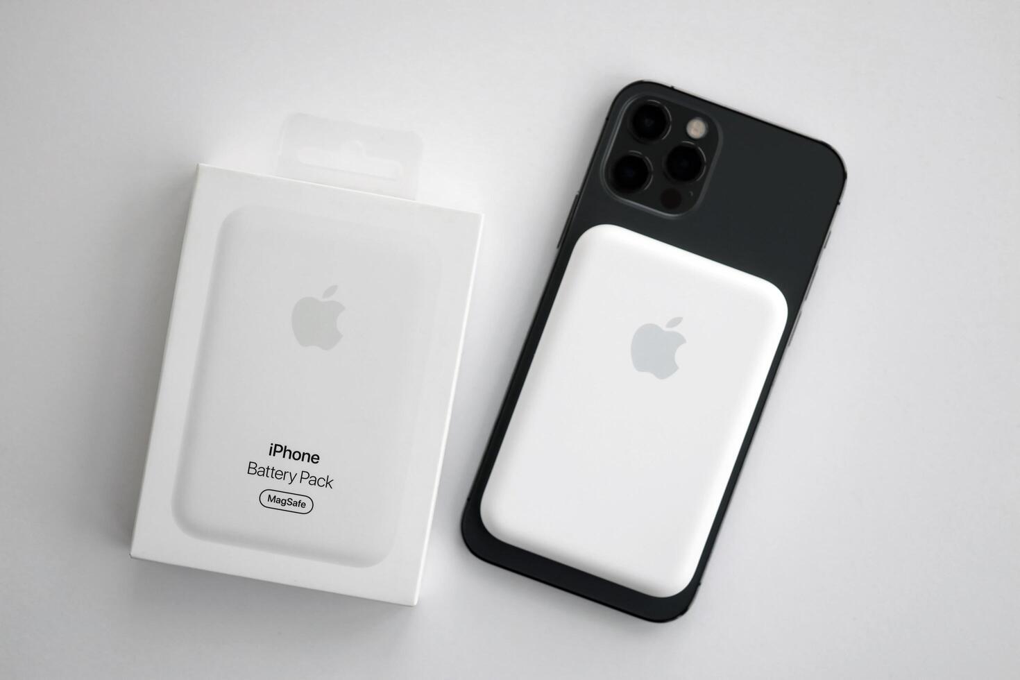 KYIV, UKRAINE - OCTOBER 31, 2023 Apple MagSafe battery device for iPhone charging via magnet connection. Mag Safe modern portable power bank photo