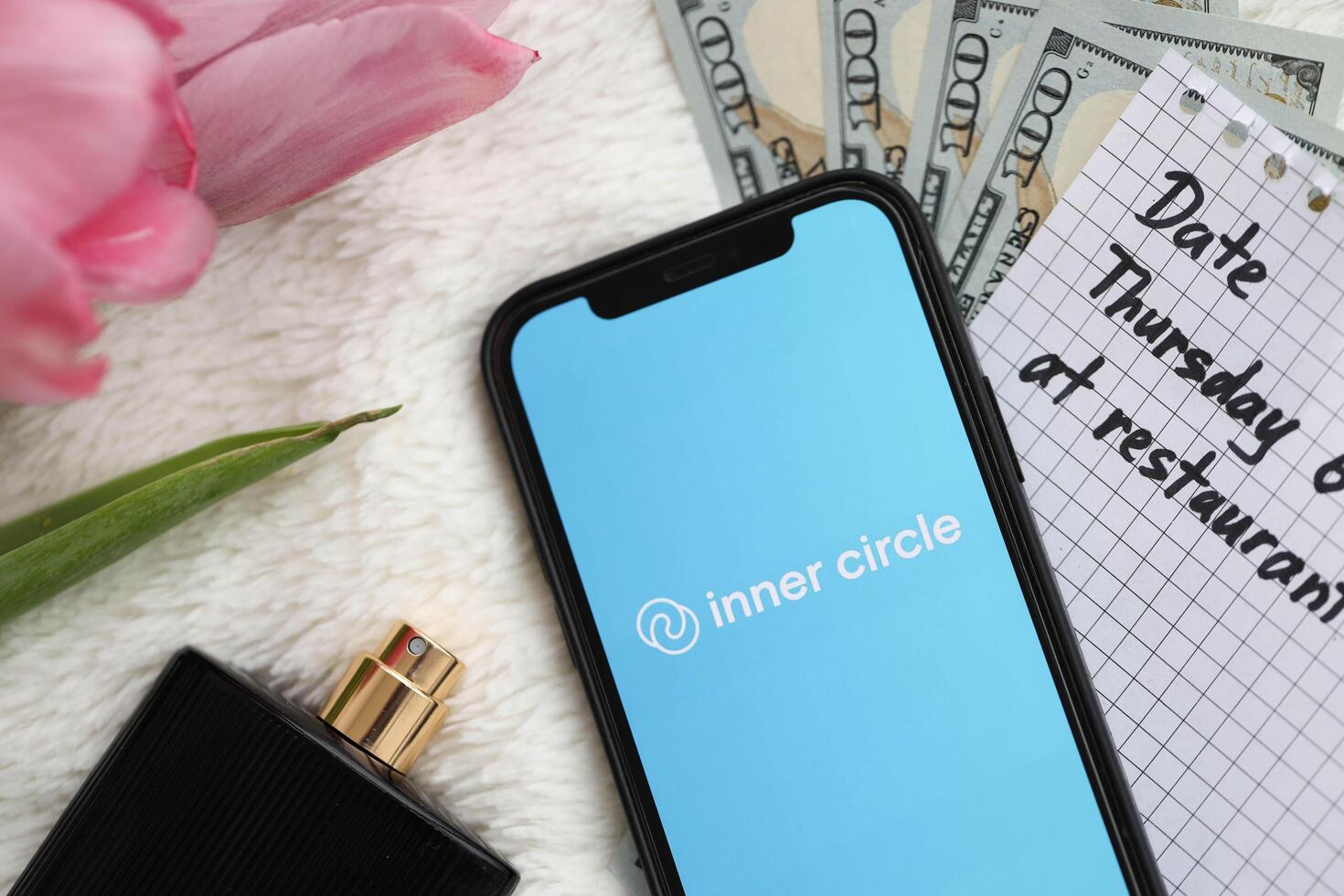 KYIV, UKRAINE - FEBRUARY 23, 2024 Inner Circle logo of famous dating website or app on iPhone display photo