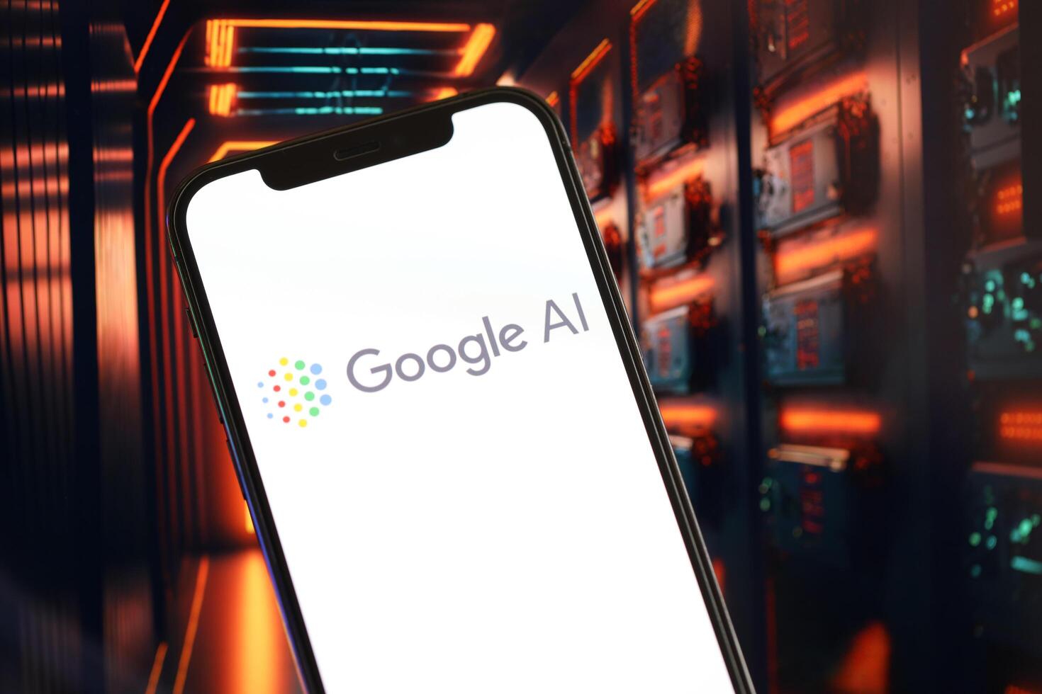 KYIV, UKRAINE - MARCH 17, 2024 Google AI logo on iPhone display screen with background of artificial intelligence futuristic image photo