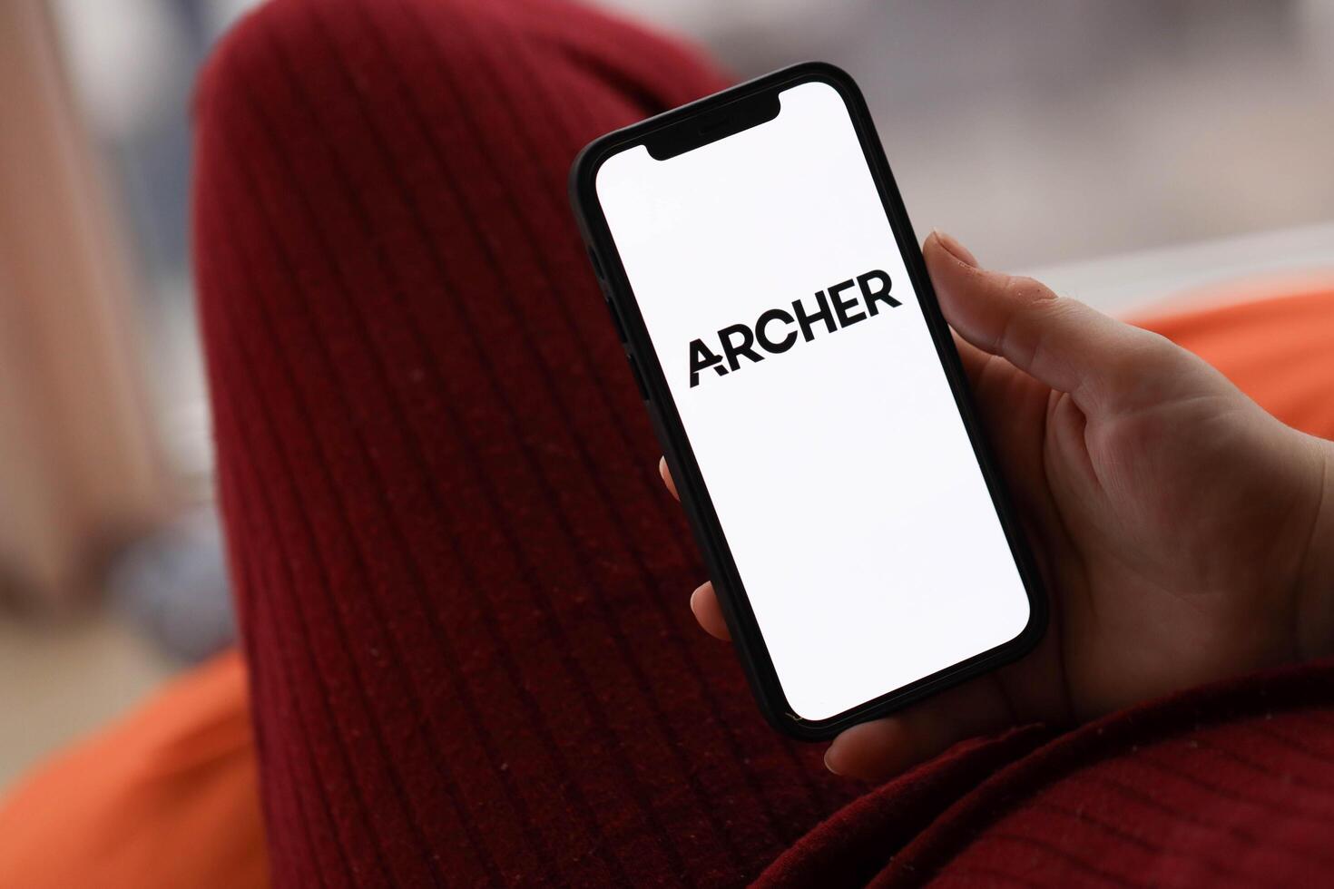 KYIV, UKRAINE - FEBRUARY 23, 2024 Archer logo of famous dating website or app on iPhone display photo