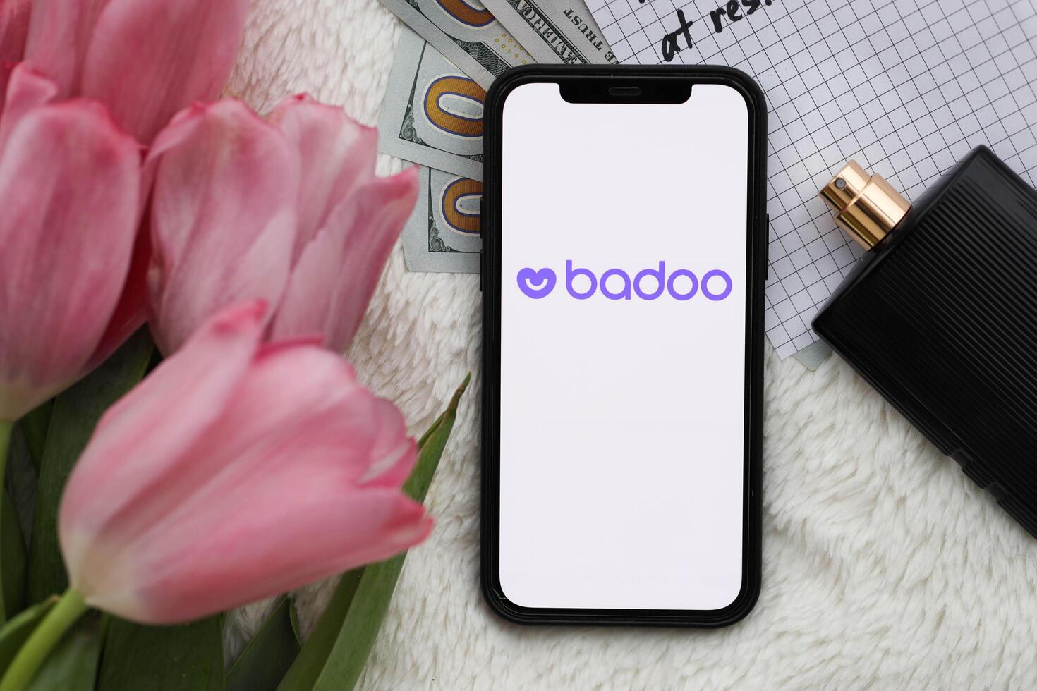 KYIV, UKRAINE - FEBRUARY 23, 2024 Badoo logo of famous dating website or app on iPhone display photo