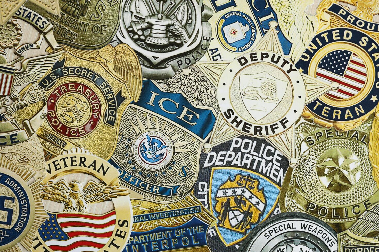 KYIV, UKRAINE - MARCH 9, 2024 Badges of different United States police departments printed on paper photo