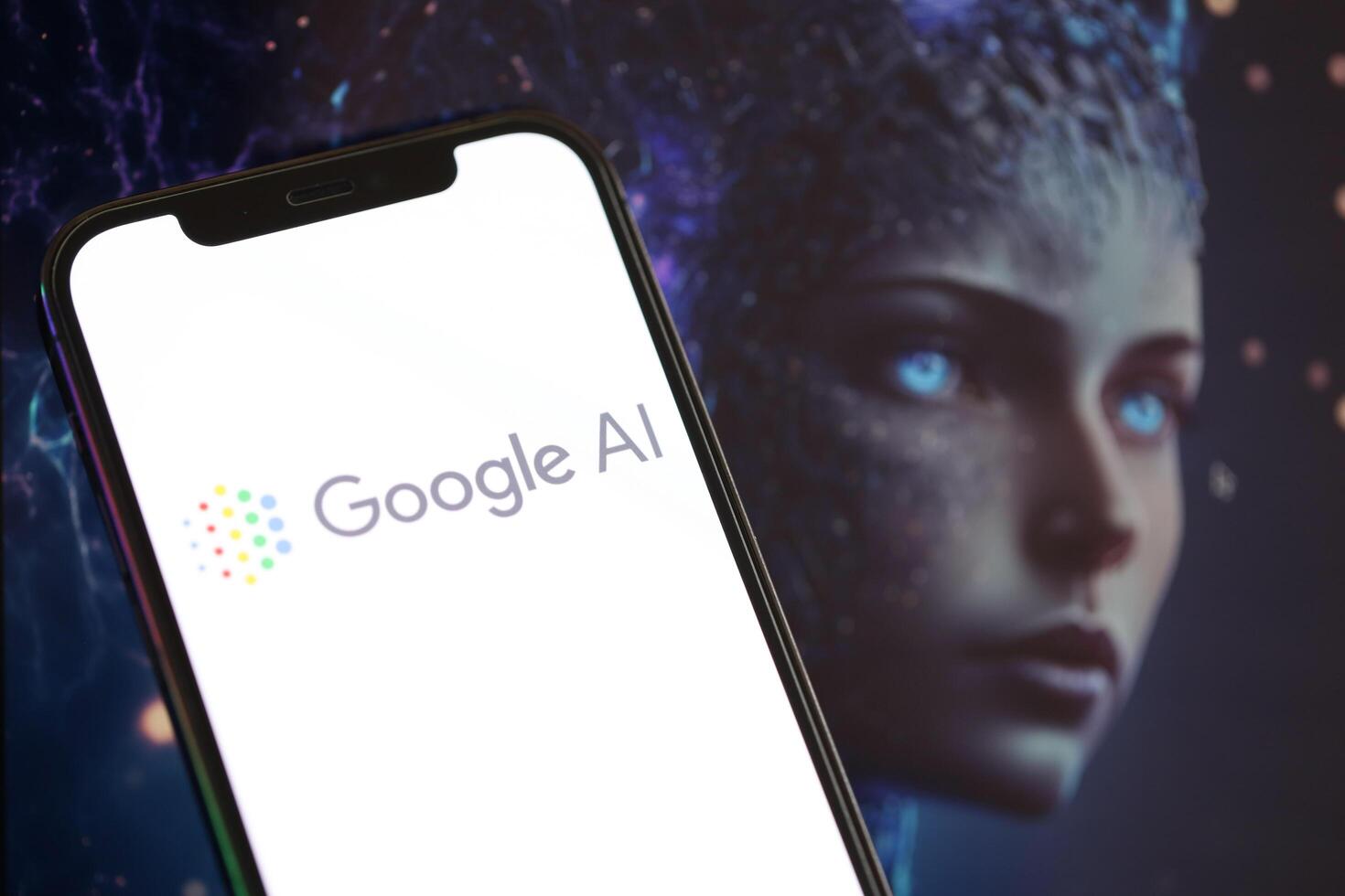 KYIV, UKRAINE - MARCH 17, 2024 Google AI logo on iPhone display screen with background of artificial intelligence futuristic image photo