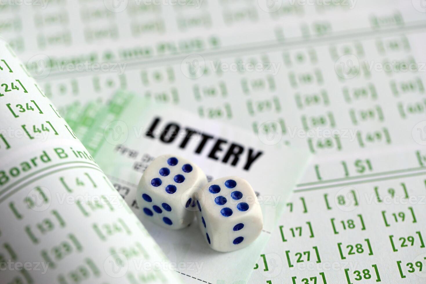 Lottery tickets and dice on blank bills with numbers for playing lottery photo