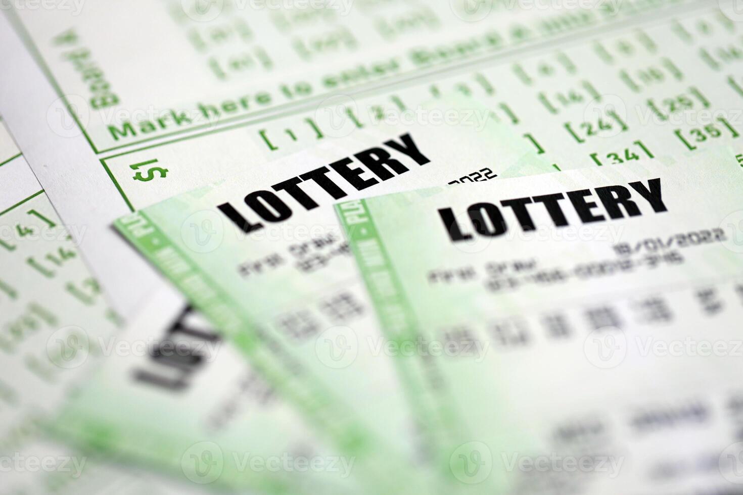 Green lottery tickets and blank bills with numbers for playing lottery photo