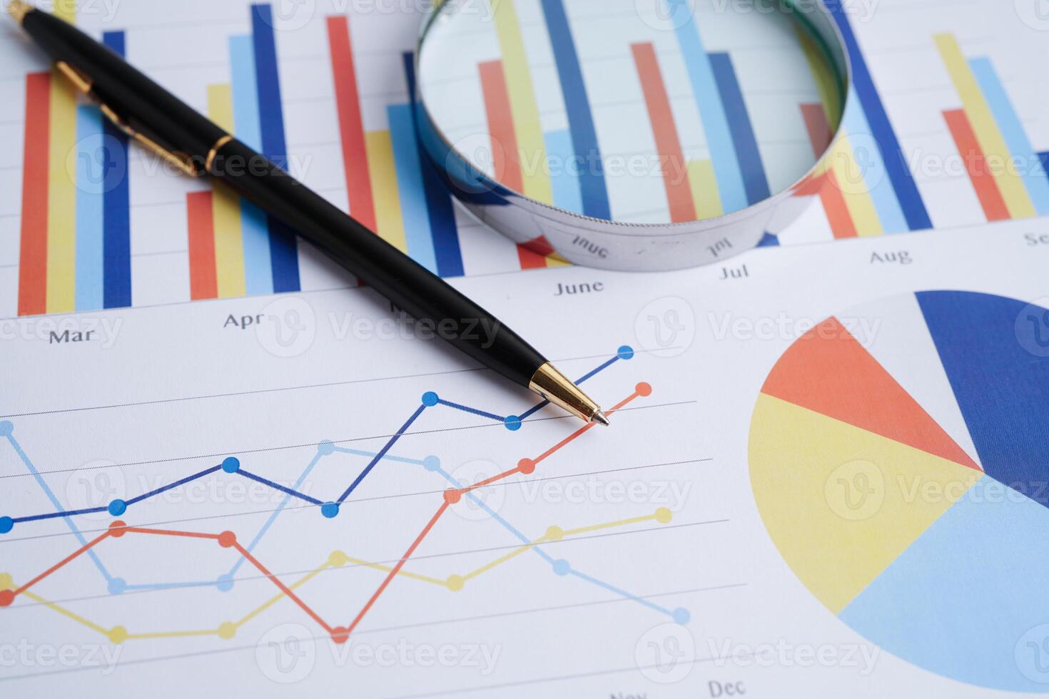 Magnifying glass on charts graphs paper. Financial development, Banking Account, Statistics, Investment Analytic research data economy. photo
