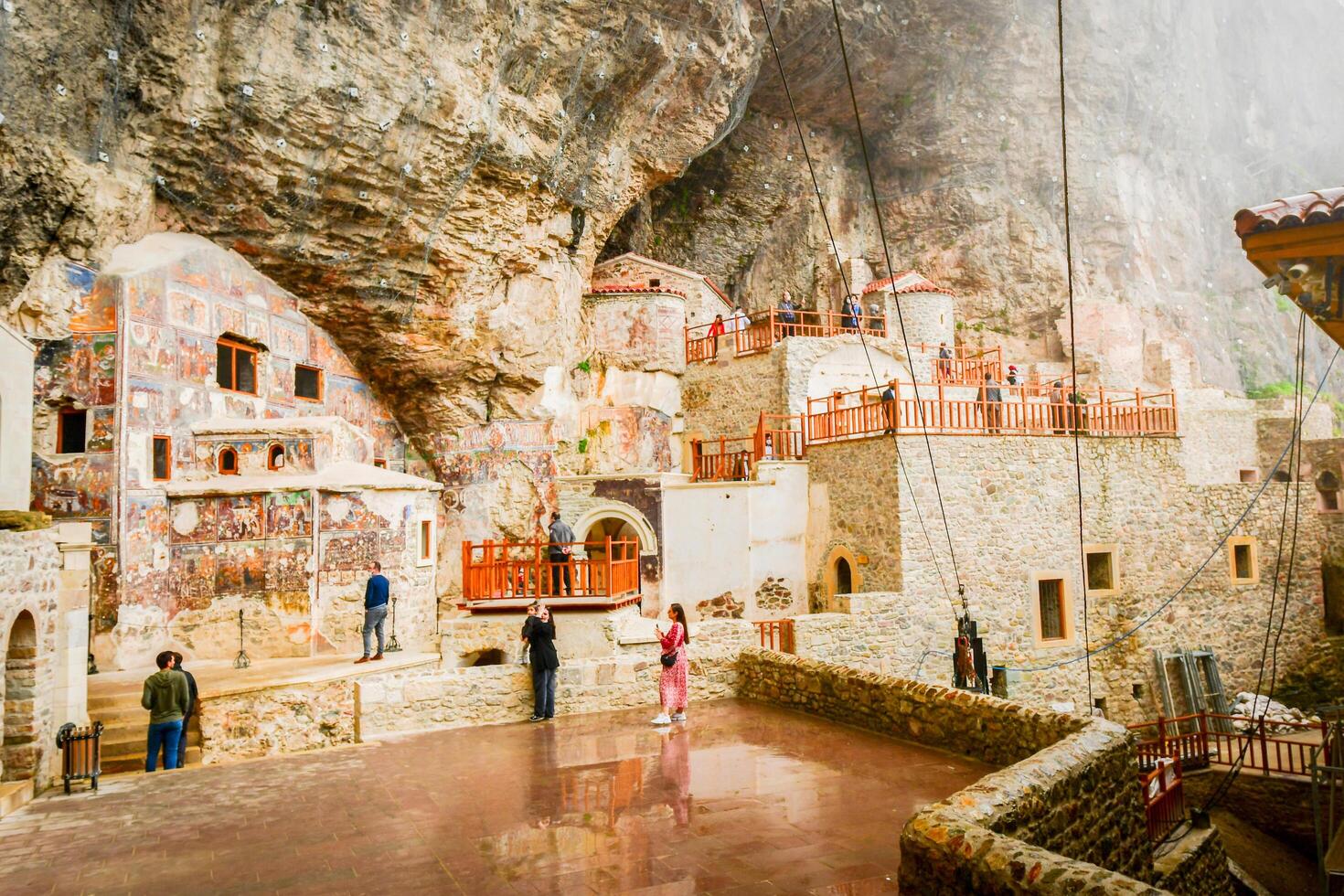 Ayder, Turkey - 12th september, 2021 - Ancient religious paintings on interior walls of famous Sumela Monastery with tourist walk and sightseeing photo