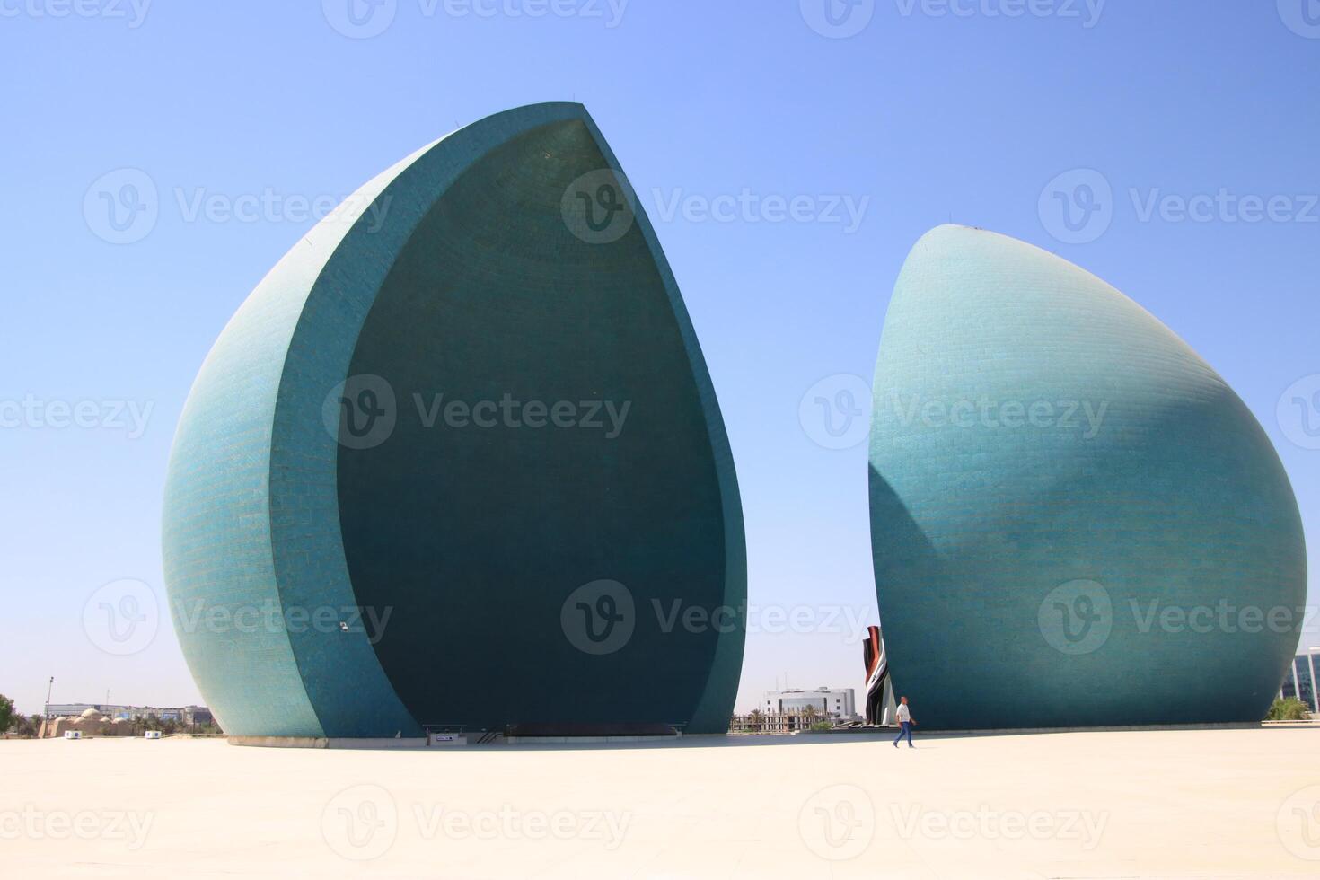 Iraqi Martyr Monument in Baghdad with blue sky photo