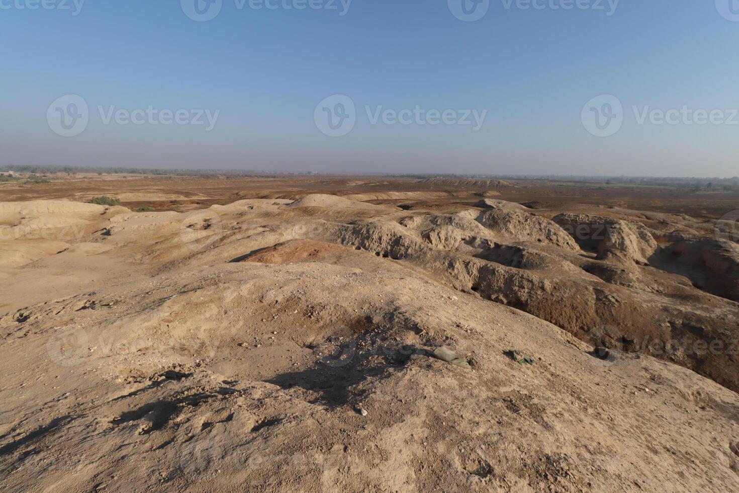 Ancient city of kish , 3100 bc , al, ahmar hill in Babylon in Iraq , ancient ruins with blue sky photo