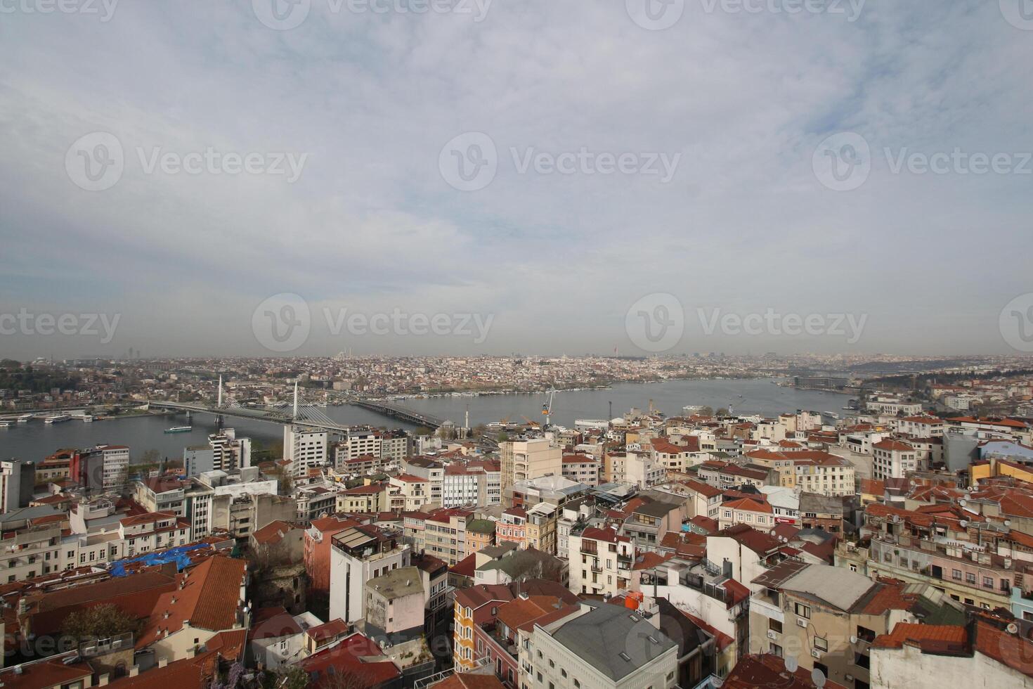 the city of istanbul from a height showing the tall buildings and the intersection of bosphourus strait photo