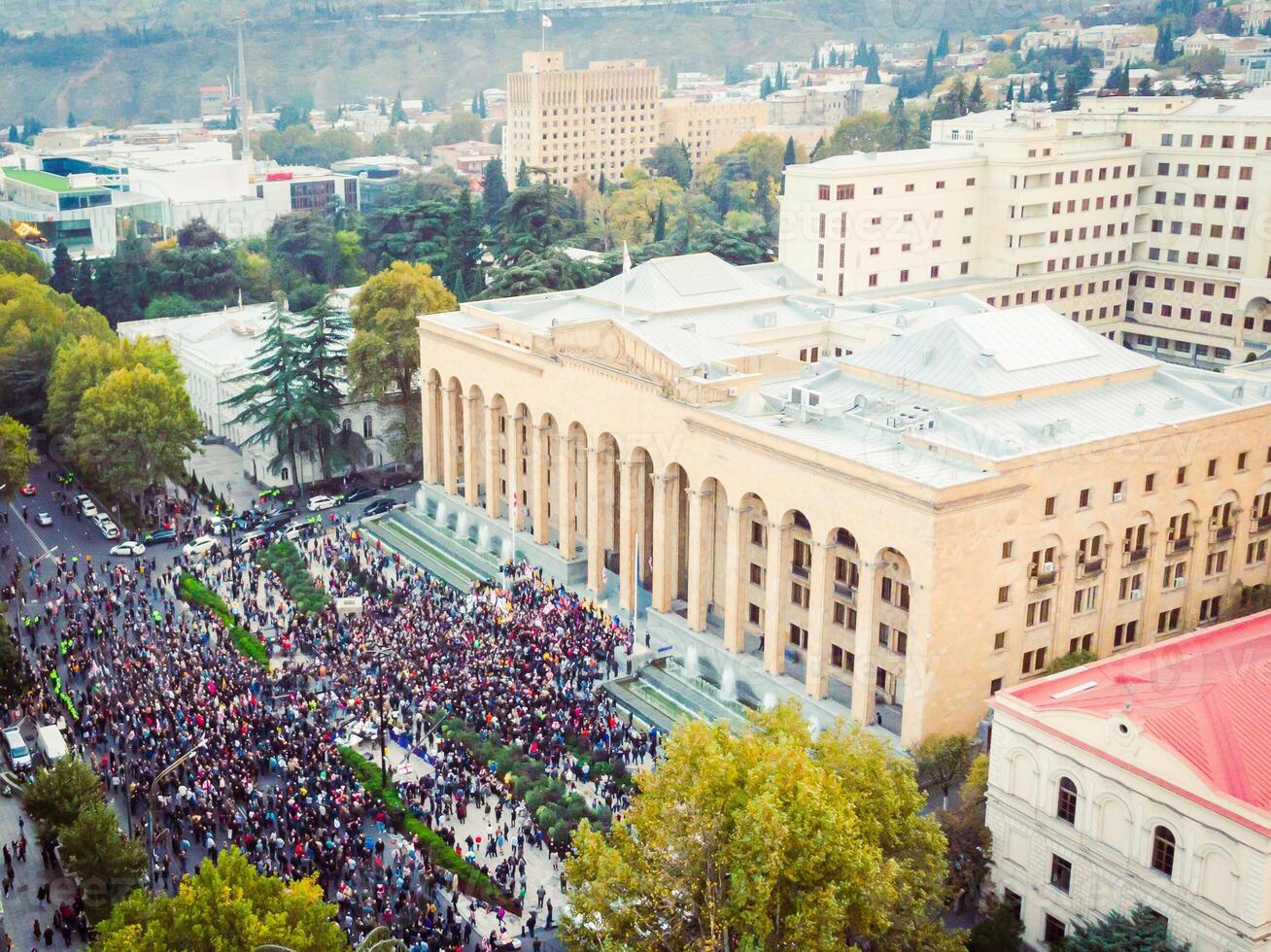 25th may, 2023 - Tbilisi, Republic of Georgia - Post election protests in Tbilisi. Aerial view of crowds of people in front of parliament building in capital city Tbilisi photo