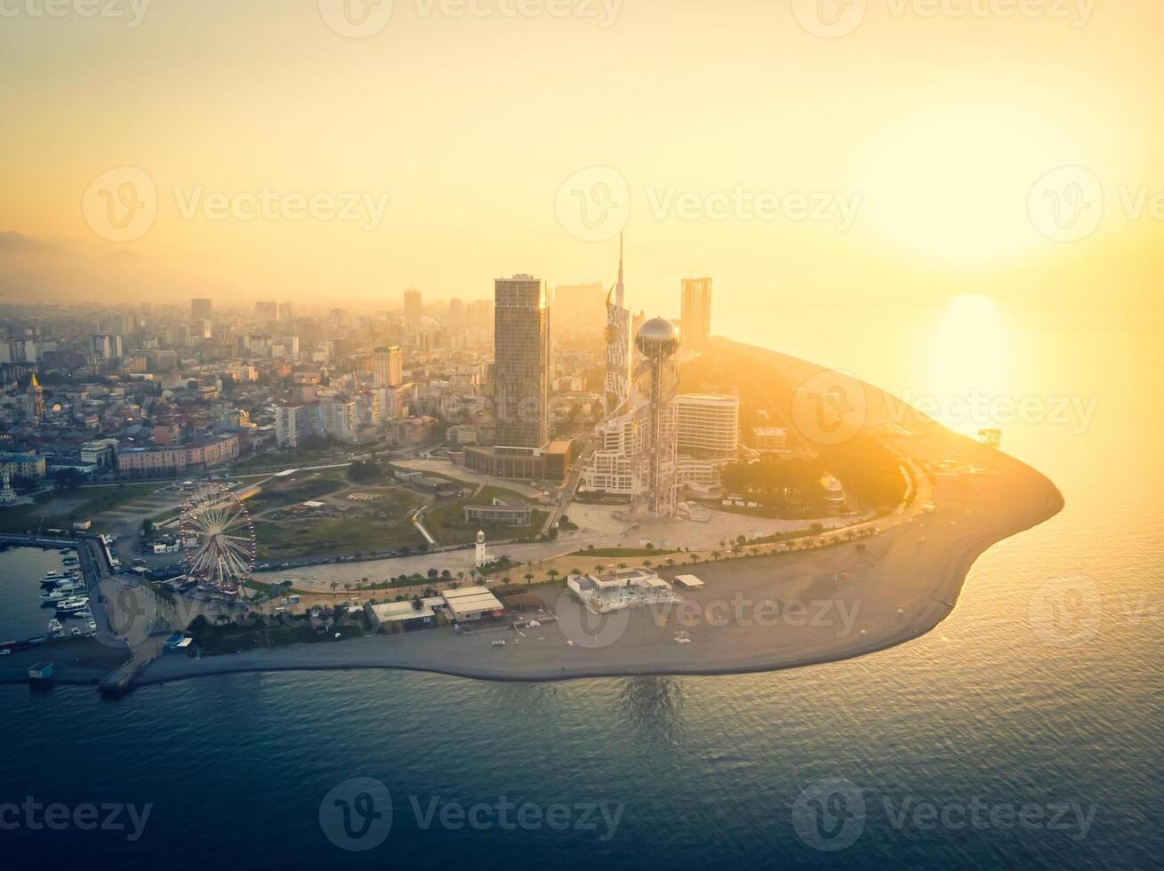 Panoramic View to Batumi coast and tourist attractions with romantic sunset in the background. Vacation holidays in caucasus. Georgian vegas. photo