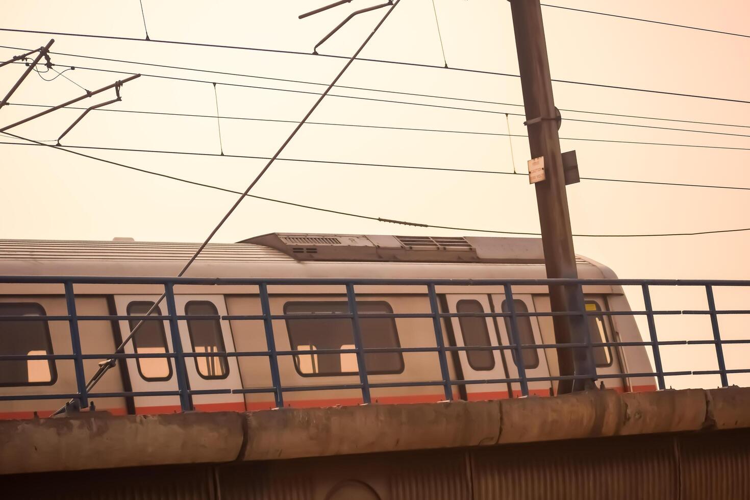 New Delhi, India, May 12 2024 - Delhi Metro train arriving at Jhandewalan metro station in New Delhi, India, Asia, Public Metro departing from Jhandewalan station photo