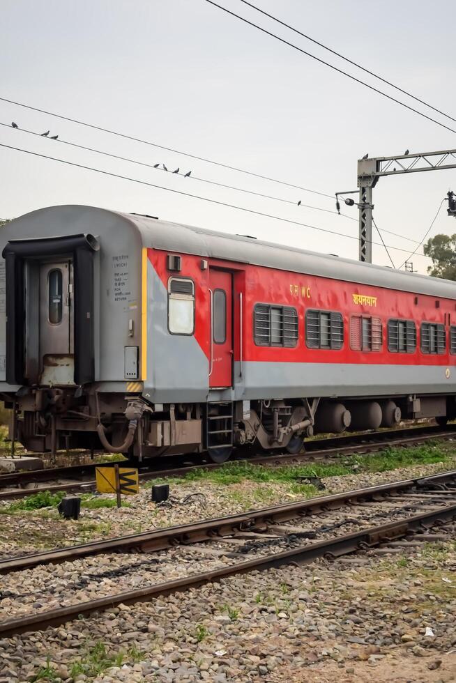 Amritsar, India, May 03 2024 - Indian railway train at Amritsar railway station platform during morning time, Colourful train at Amritsar, Punjab railway station photo