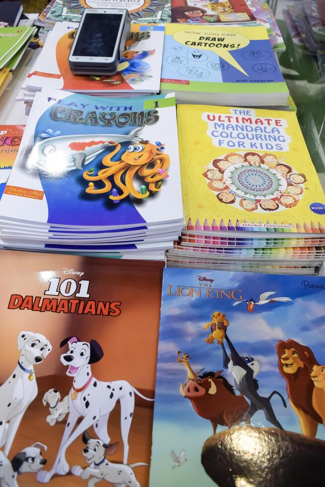 New Delhi, India, May 7 2024 - Variety of Books on shelf inside a book-stall at Delhi International Book Fair, Selection of books on display in Annual Book Fair at Bharat Mandapam complex photo