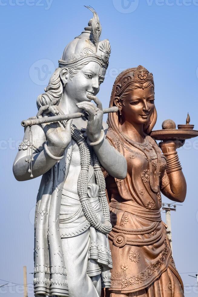 Big statue of Lord Radha Krishna near Delhi International airport, Delhi, India, Lord Krishna and Radha big statue touching sky at main highway Mahipalpur, Delhi photo