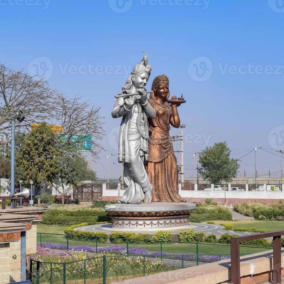 Big statue of Lord Radha Krishna near Delhi International airport, Delhi, India, Lord Krishna and Radha big statue touching sky at main highway Mahipalpur, Delhi photo