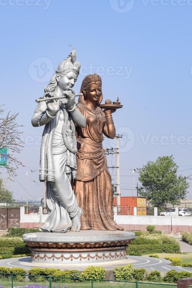 Big statue of Lord Radha Krishna near Delhi International airport, Delhi, India, Lord Krishna and Radha big statue touching sky at main highway Mahipalpur, Delhi photo