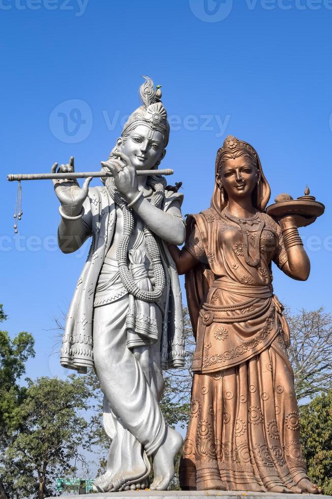 Big statue of Lord Radha Krishna near Delhi International airport, Delhi, India, Lord Krishna and Radha big statue touching sky at main highway Mahipalpur, Delhi photo