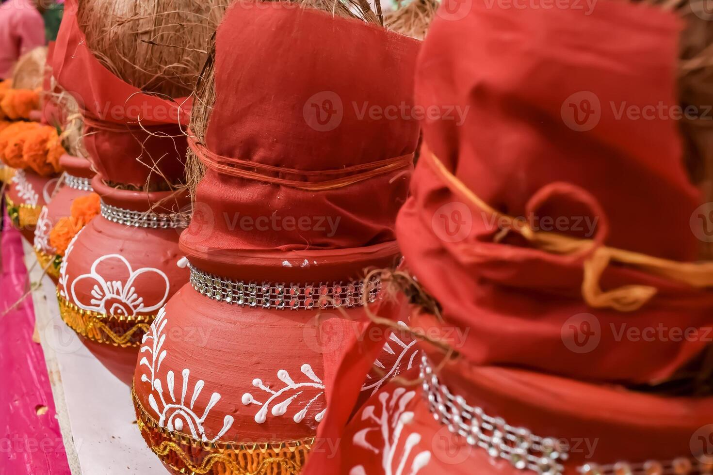 Kalash with coconut and mango leaf with floral decoration earthen pots containing sacred water. Kalash for hindu puja during Jagannath Temple Mangal Kalash Yatra, front view, closeup photo