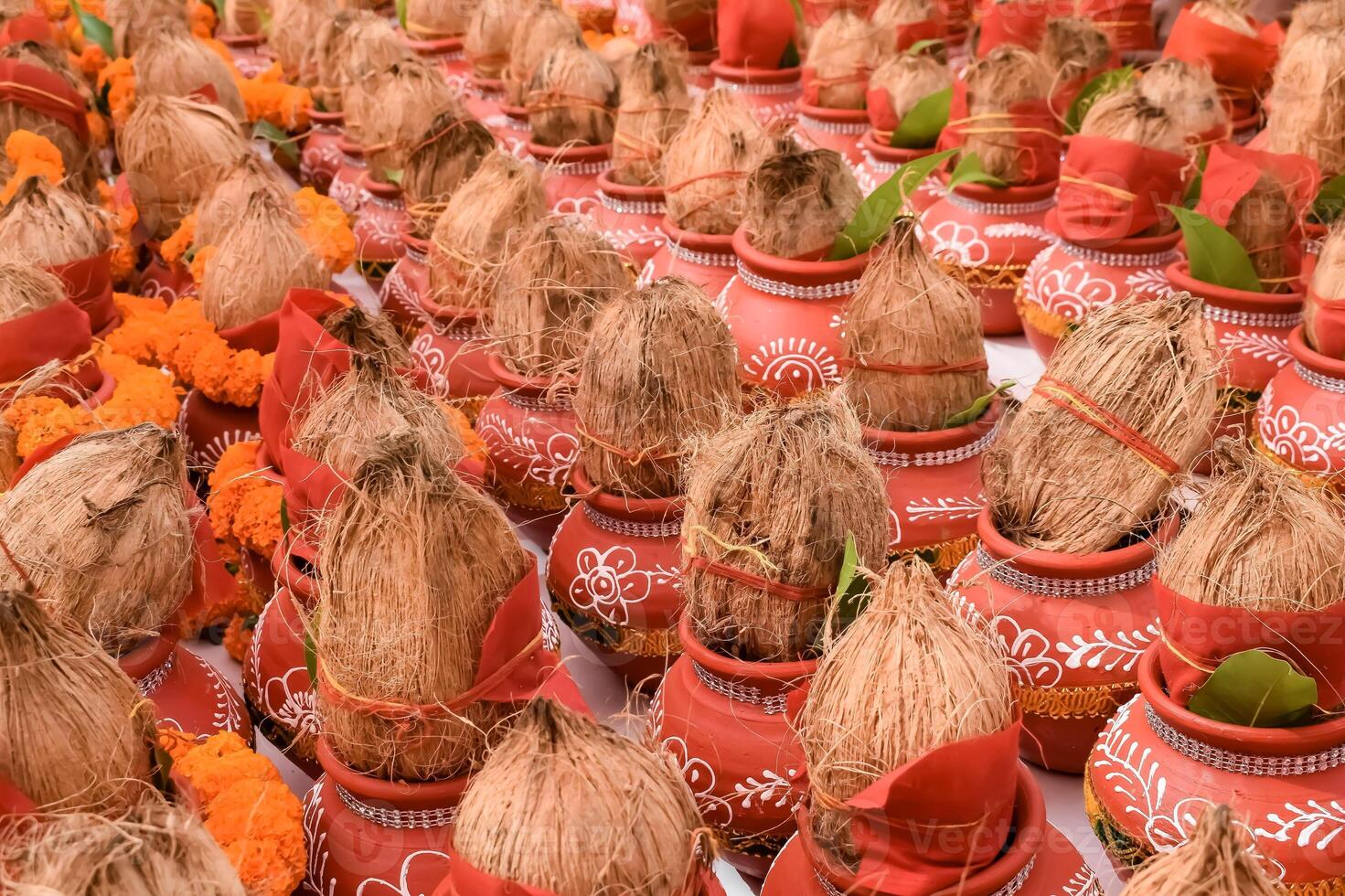 Kalash with coconut and mango leaf with floral decoration earthen pots containing sacred water. Kalash for hindu puja during Jagannath Temple Mangal Kalash Yatra, front view, closeup photo