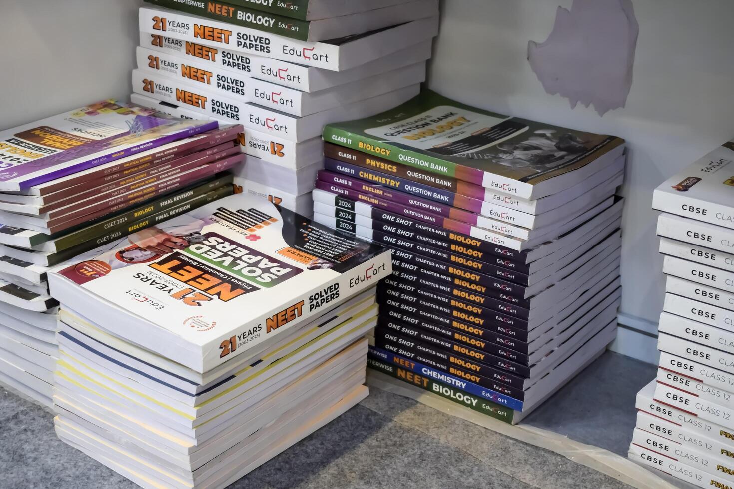 New Delhi, India, May 7 2024 - Variety of Books on shelf inside a book-stall at Delhi International Book Fair, Selection of books on display in Annual Book Fair at Bharat Mandapam complex photo
