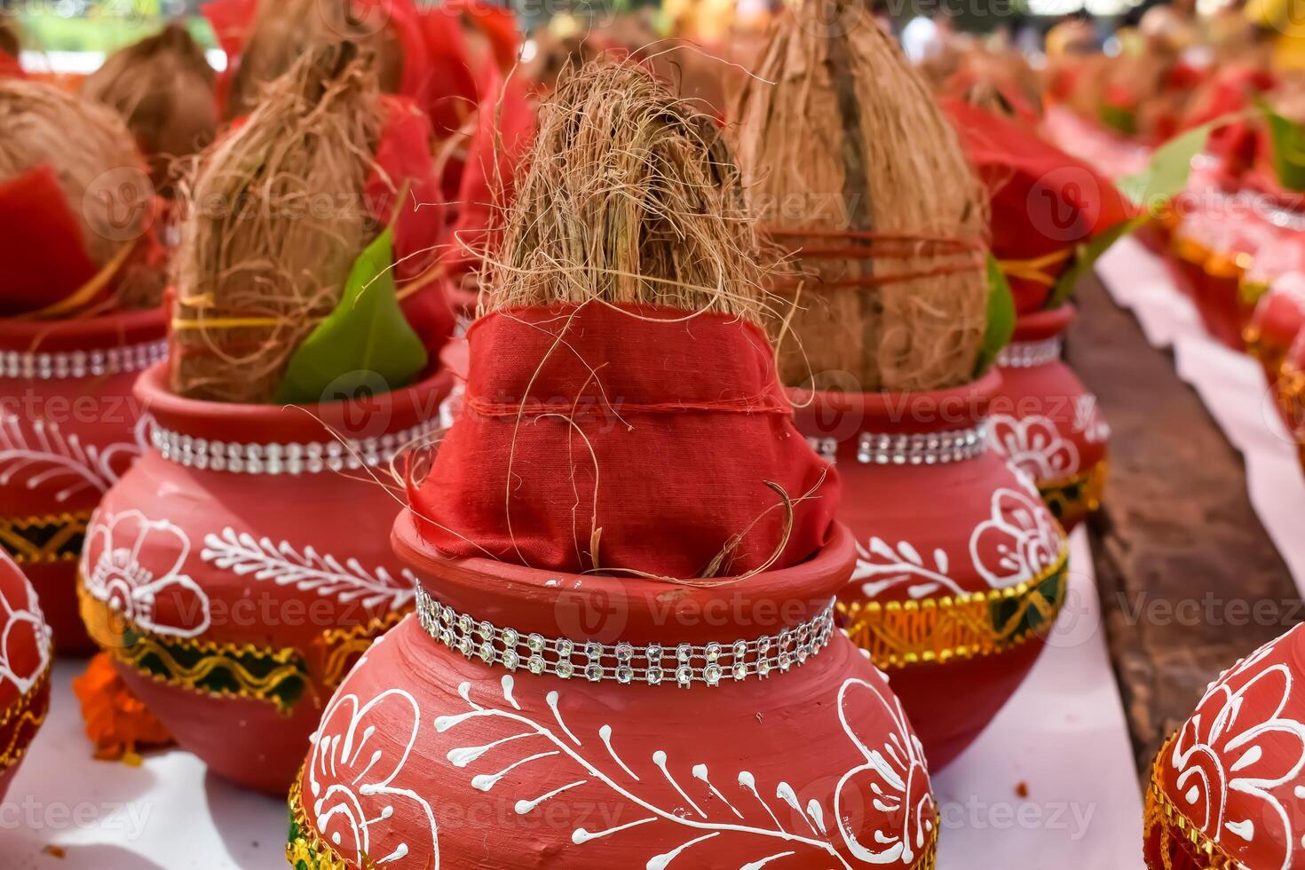 Kalash with coconut and mango leaf with floral decoration earthen pots containing sacred water. Kalash for hindu puja during Jagannath Temple Mangal Kalash Yatra, front view, closeup photo