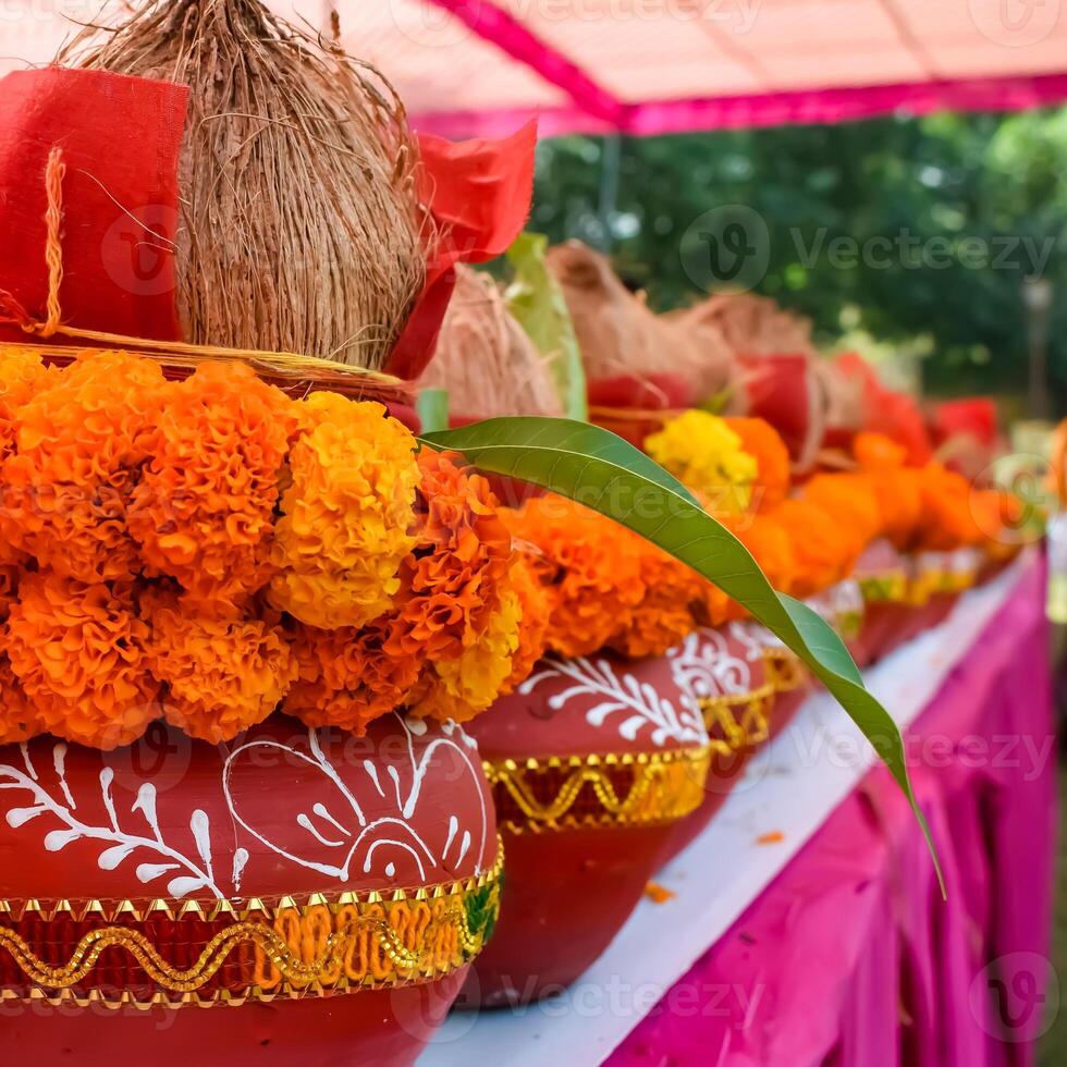 Kalash with coconut and mango leaf with floral decoration earthen pots containing sacred water. Kalash for hindu puja during Jagannath Temple Mangal Kalash Yatra, front view, closeup photo