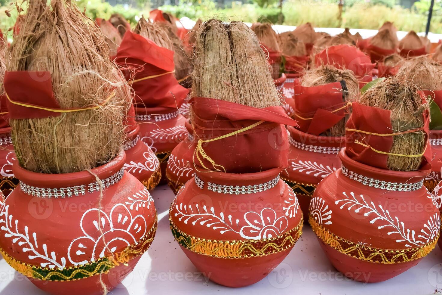 Kalash with coconut and mango leaf with floral decoration earthen pots containing sacred water. Kalash for hindu puja during Jagannath Temple Mangal Kalash Yatra, front view, closeup photo