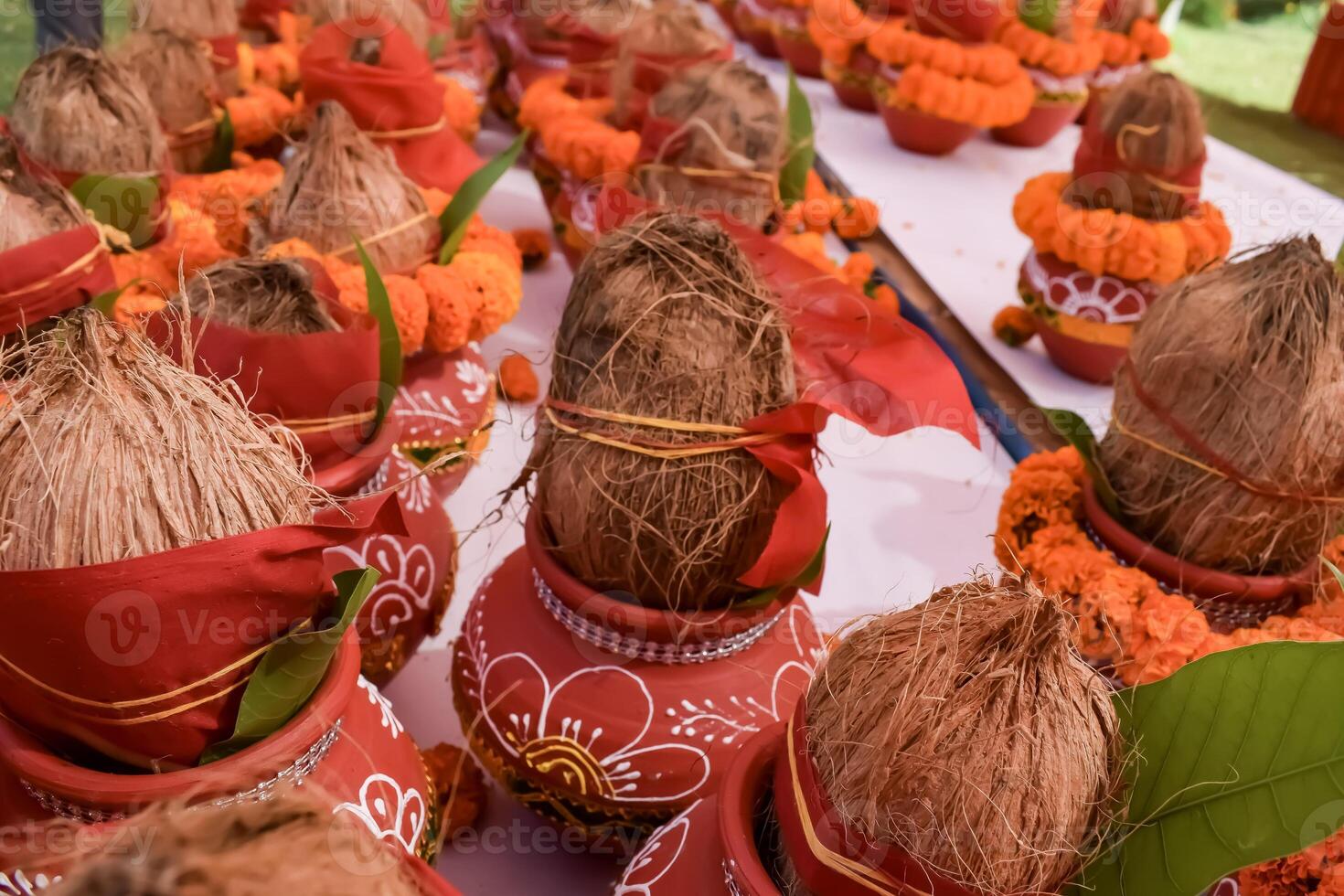 Kalash with coconut and mango leaf with floral decoration earthen pots containing sacred water. Kalash for hindu puja during Jagannath Temple Mangal Kalash Yatra, front view, closeup photo