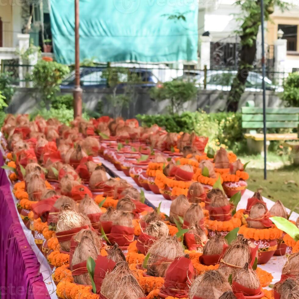 Kalash with coconut and mango leaf with floral decoration earthen pots containing sacred water. Kalash for hindu puja during Jagannath Temple Mangal Kalash Yatra, front view, closeup photo