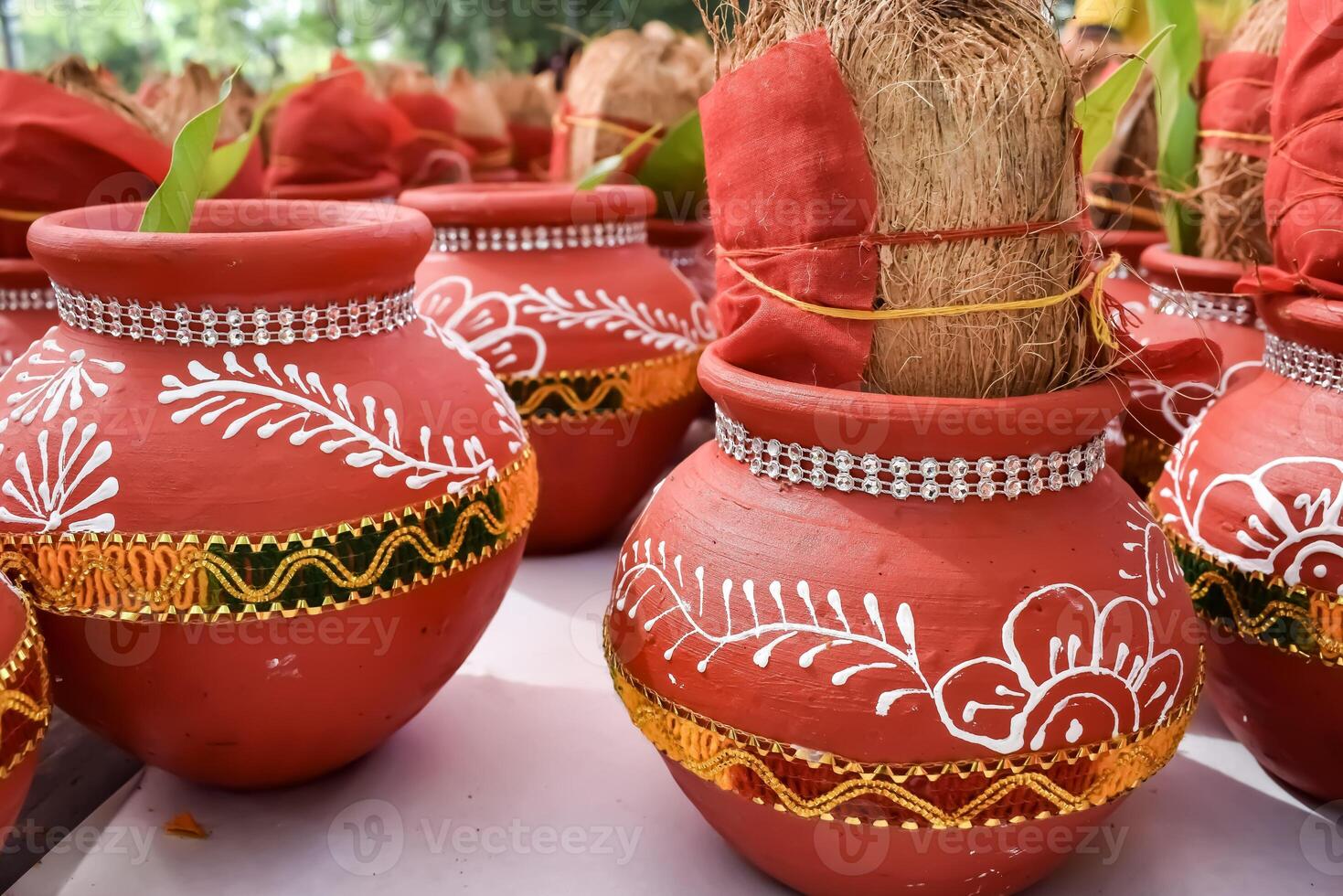 Kalash with coconut and mango leaf with floral decoration earthen pots containing sacred water. Kalash for hindu puja during Jagannath Temple Mangal Kalash Yatra, front view, closeup photo