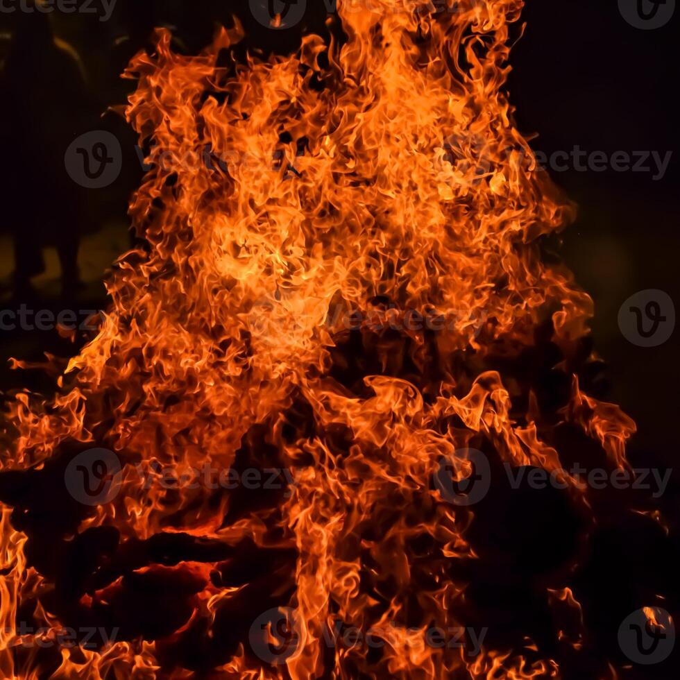 Fire flames on black background, Blaze fire flame texture background, Beautifully, the fire is burning, Fire flames with wood and cow dung bonfire photo