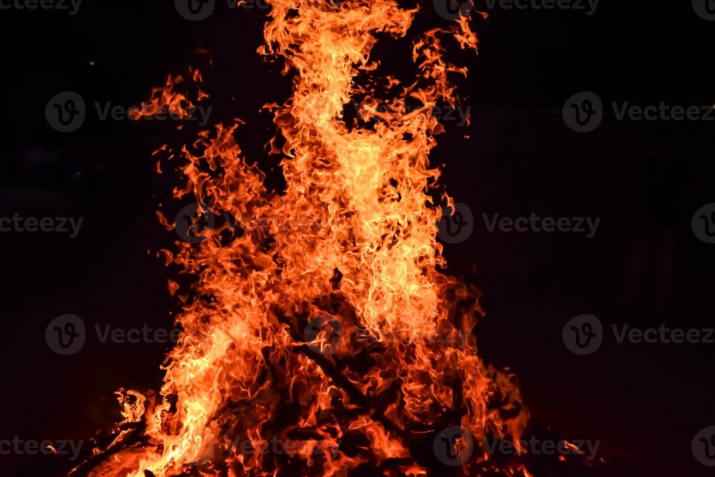Fire flames on black background, Blaze fire flame texture background, Beautifully, the fire is burning, Fire flames with wood and cow dung bonfire photo
